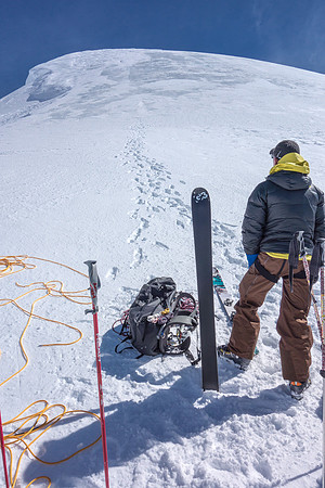 Packing up the skis to climb part way up North Twin's ridge.