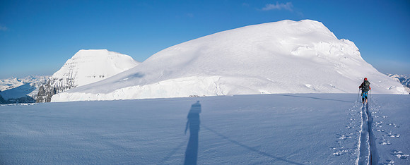 Ben skis towards North Twin with South Twin on the left. The bench along North Twin's east face is obvious.