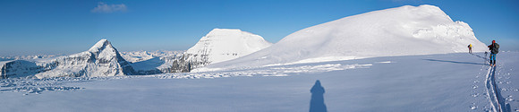 Ben skis towards North Twin with South Twin on the left. The bench along North Twin's east face is obvious.