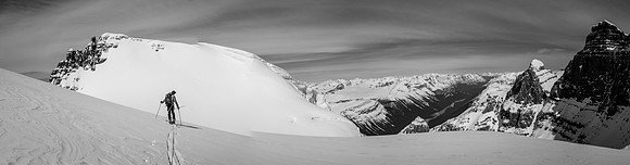 JW skis to the South / West Twin col. The summit of West Twin on upper left, Twin's Tower on upper right.