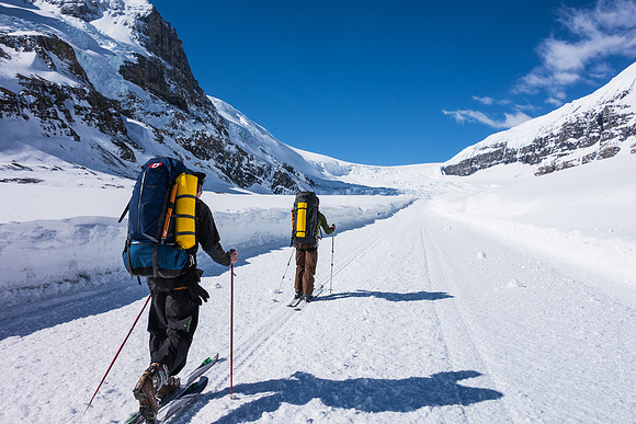 Skinning up the snow coach road on the Athabasca Glacier.