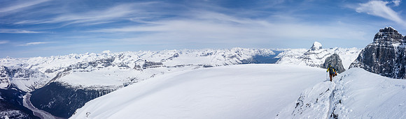 Heading back on the summit ridge with the north and east peaks on display.