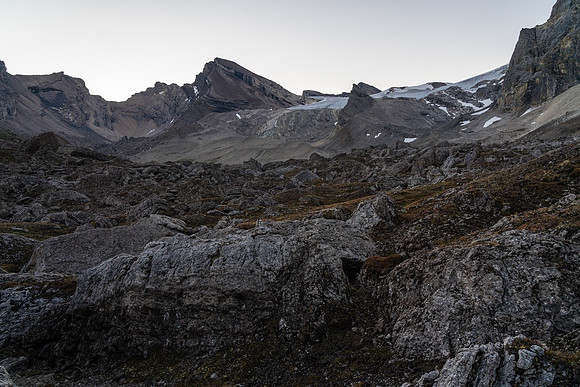 Crossing a boulder field on route to a distant Deluc Mountain.
