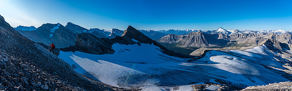 An incredible panorama of peaks starts to appear as we ascend the SW slopes of Deluc.
