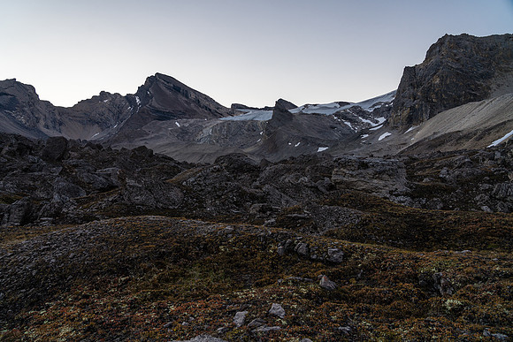 Crossing a boulder field on route to a distant Deluc Mountain.