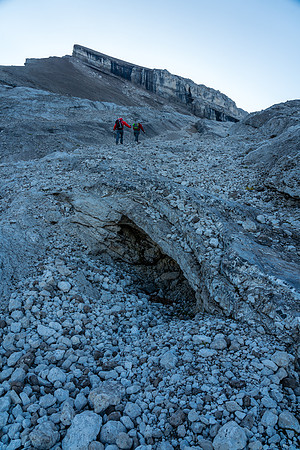 Ascending scree / slabs and frozen dirt to the Deluc Glacier.