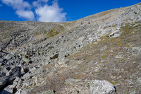 A steep grunt from the tarn to the top of the col.