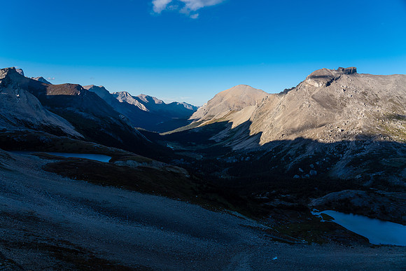 Views past the high bivy lake (L) to a distant Clearwater River Valley.
