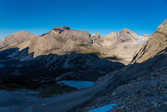 Looking over the low bivy lake to Deluc Mountain (R).