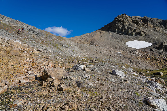 A steep grunt from the tarn to the top of the col.