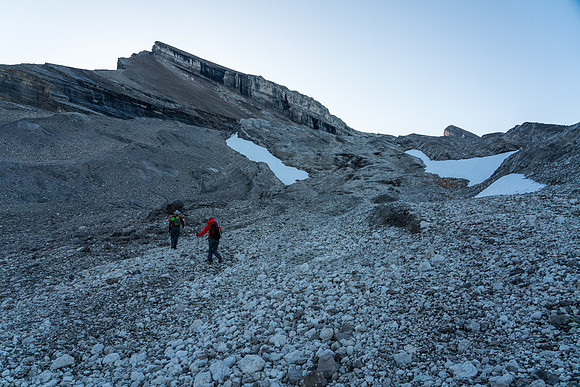 Ascending scree / slabs and frozen dirt to the Deluc Glacier.
