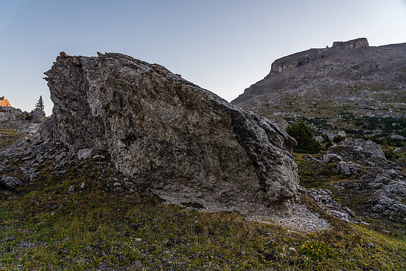 Crossing a boulder field on route to a distant Deluc Mountain.