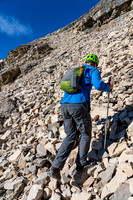 Hiking and scrambling up steep scree to break the cliffs guarding the upper SW face of Dip Slope.