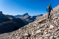 Cornelius starts the scree ascent of Dip Slope's SW face.