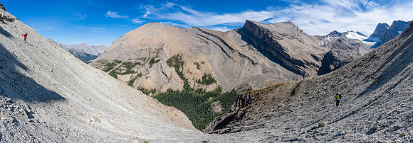 Mike tip toes across the hard, steep shale slope at left while Cornelius finishes up at right.