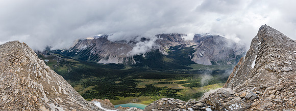 Dramatic views over the Pipestone River towards Cataract Peak rising in clouds at right.