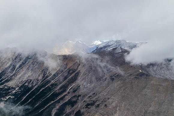 Breaks in the clouds hint at distant views.
