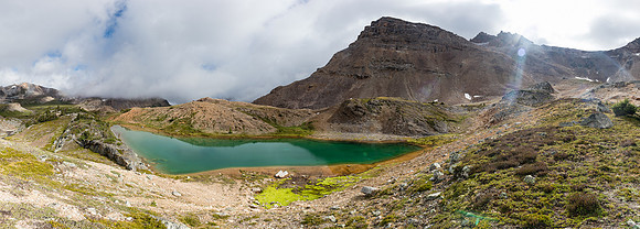 A small, unexpected pond at the bottom of Minnow Peak's west scree slopes.