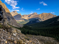 Traversing a goat path along cliffs to the west to avoid wet bushwhacking.