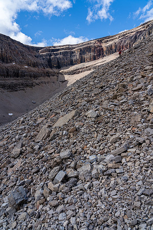 The sun comes back out over the curtain wall cliffs as we descend.