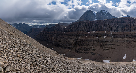 Descending back down to the valley with dramatic stormy skies above.