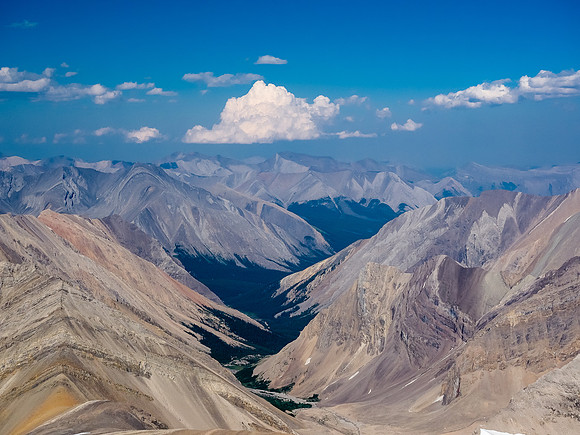 A telephoto down McConnell Creek leading towards obscure peaks such as Boar Station.