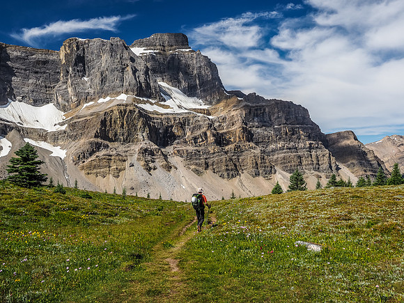 Phil hikes beneath the east face of Noseem Mountain.