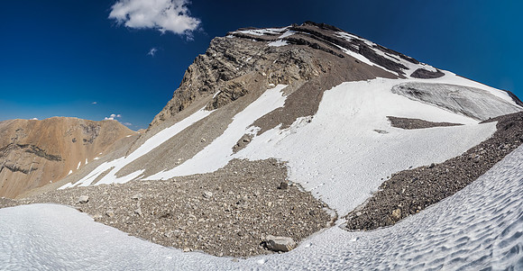 The small glacier at center and the extremely foreshortened scree bench at upper center trending left. There's at least 400 vertical meters left at this point.