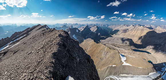 Phil is tiny on the summit ridge as he descends. Willingdon rises in the distance in this view north.