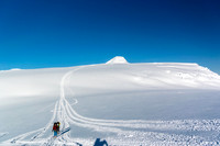Looking back at our ski tracks descending the trench with Mount Columbia peeking over the edge.