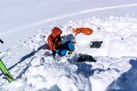 Ben enjoys a late lunch after ascending Snow Dome.