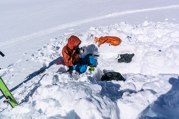 Ben enjoys a late lunch after ascending Snow Dome.