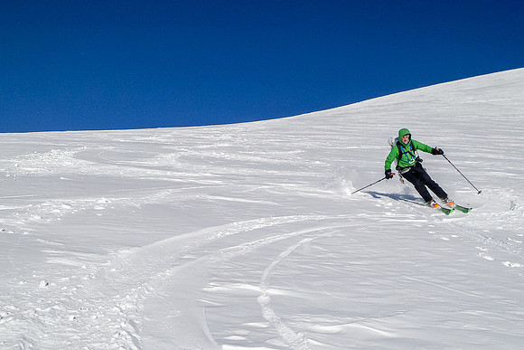 Vern skis down - what a blast!! Photo by Steven Song.