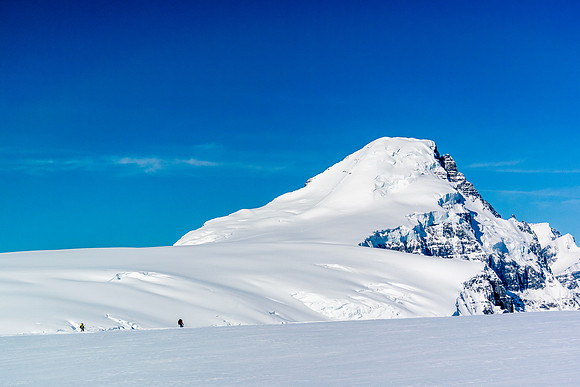 Dwarfed by the terrain. Hard to believe that 12 hours ago we were on top of that beast!