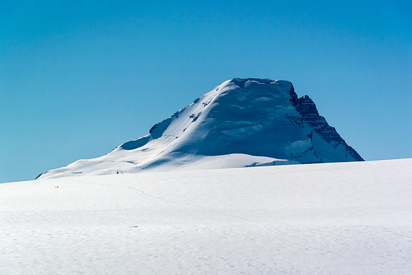 Spot the tiny figures skiing across our tracks at left. They are exiting the Saskatchewan Glacier. Columbia looms many kms distant now.
