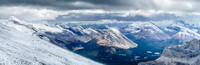 A wild scene of wind, snow, rock, larches and water. The lower Red Deer Lakes catch some sun as we descend.