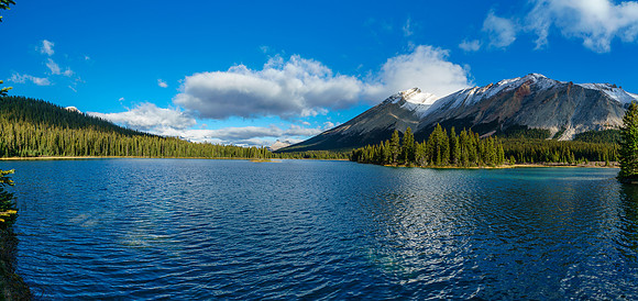 A pano of Red Deer Lake with Cyclone and Pipestone peaks on the right, Molar in the far distance.