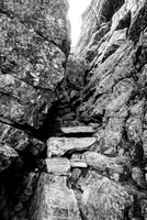 An obscure route through a slot and under a chockstone to break the cliffs to Myosotis Lake.