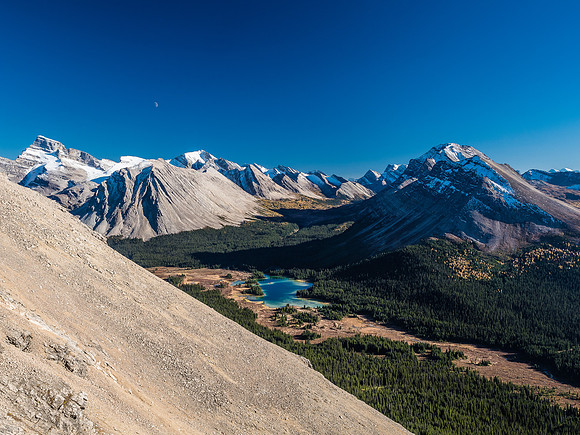 The moon rises over Oyster Ridge at left.