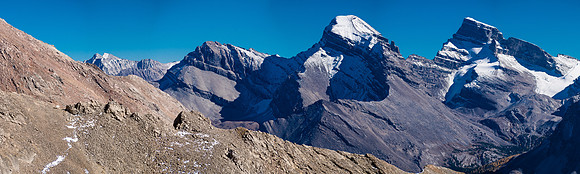 A magnificent scene of snow and rock - made even better with a magnificent Billy Goat at far left.