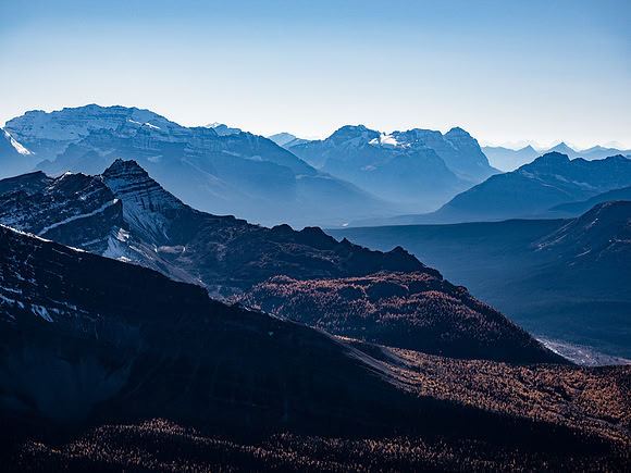 Looking far to the west towards Mount Victoria (L), Cathedral Mountain (C) and Mount Stephen.