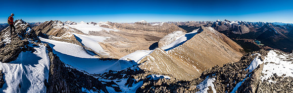 Phil on the summit of Cyclone Mountain with views over the Drummond Glacier at left, Mount Drummond at center right and Pipestone at right