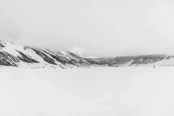Slowly skiing under the cloud cap.