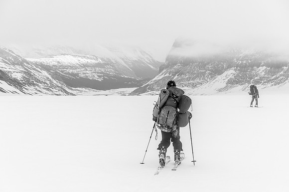 Slowly skiing under the cloud cap.