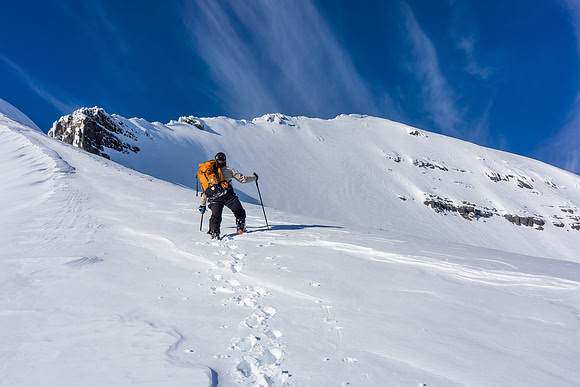 Feeling good! At this point we thought we might actually make the summit! Ferenc kicks steps up the firm southeast ridge.