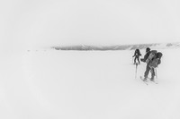 Slowly skiing under the cloud cap.