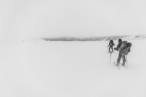 Slowly skiing under the cloud cap.