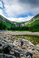 The terrain to the waterfall draining the third lake is already less traveled than around the first lake.