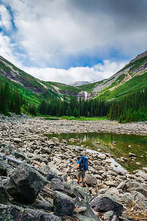 The terrain to the waterfall draining the third lake is already less traveled than around the first lake.