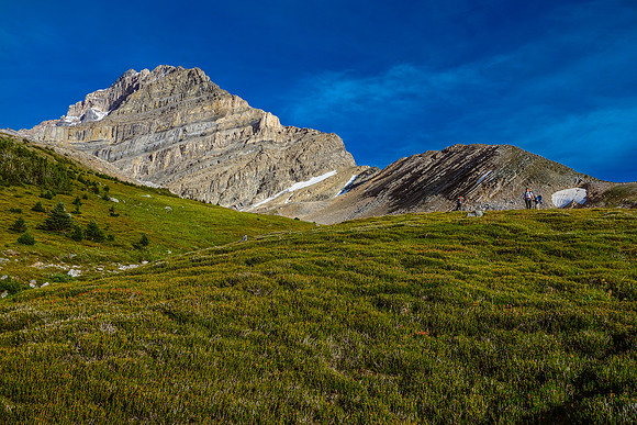 Descending the meadows with the dry north ridge of Fryatt rising at left.